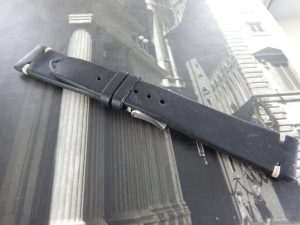 Black leather with white stitching hand made strap